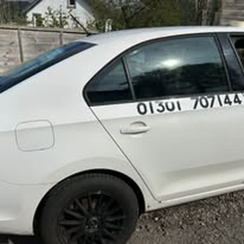 White Trident taxi with 01301 707144 door number